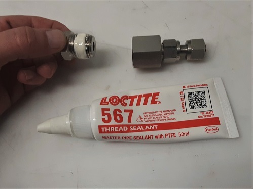 Loctite 567 sealant applied to fitting